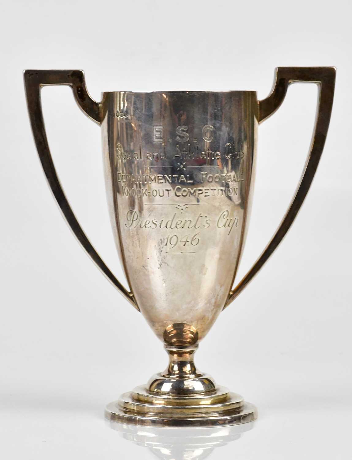 GLADWIN LTD; a George V hallmarked silver twin handled pedestal trophy cup on stepped base,
