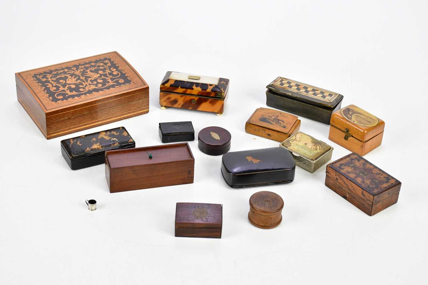 A collection of early 19th century and later snuff boxes including a Georgian papier-mâché