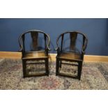 A pair of reproduction Chinese elm horseshoe back chairs (2).