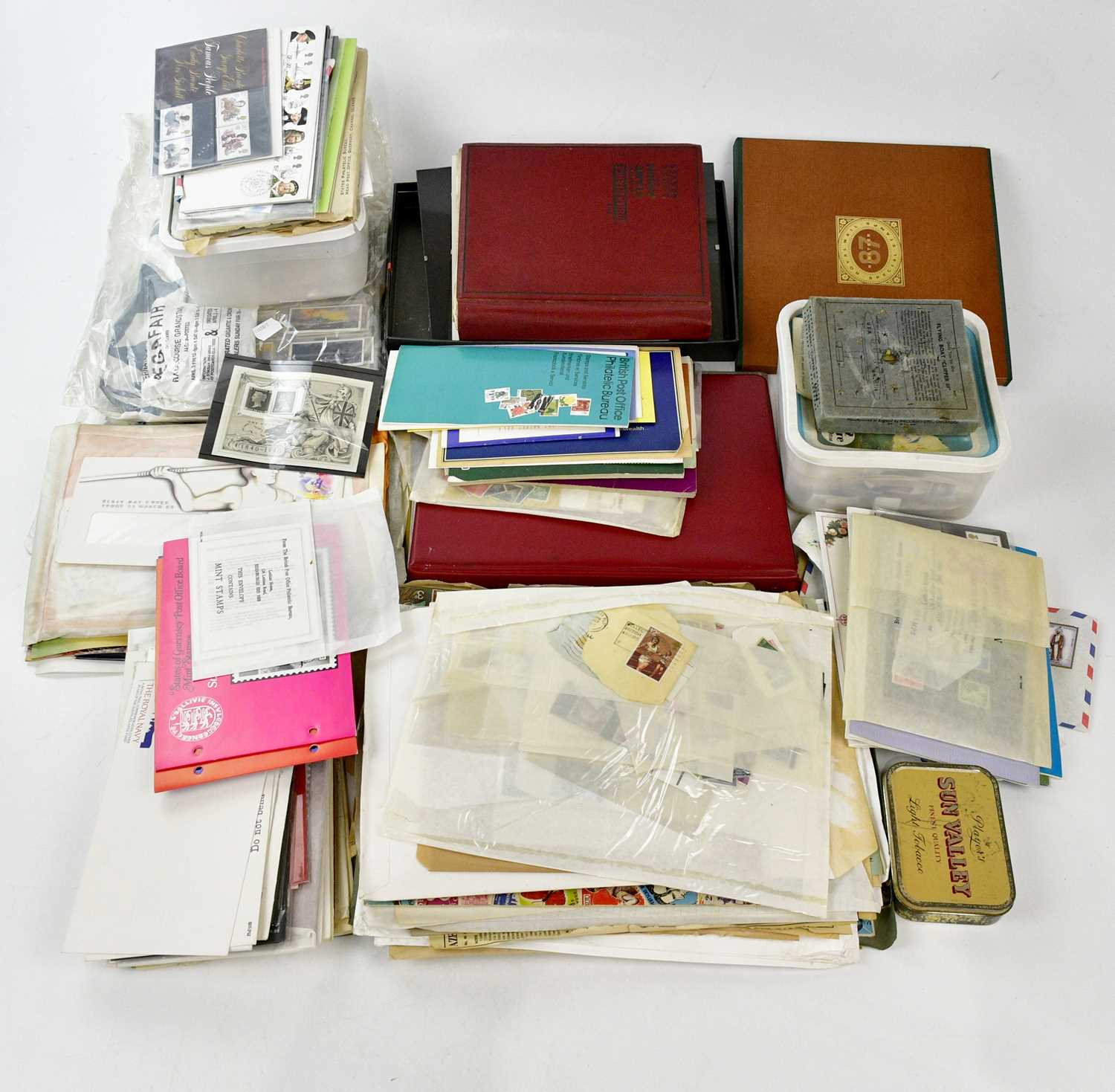 A large quantity of assorted first day covers and cigarette cards, also stamps.