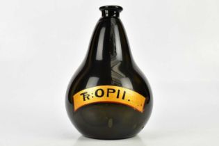 A Victorian black glass pharmaceutical bottle with gilt label 'TR:OPII', height 30cm. Condition