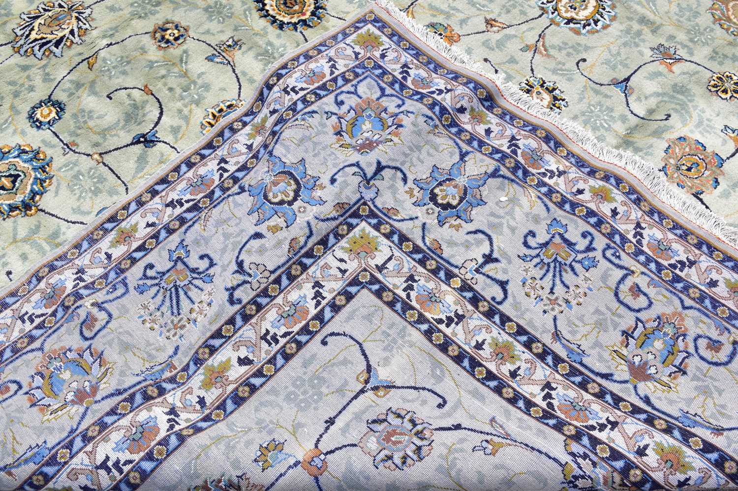 A pale blue wool carpet with floral pattern, 400 x 300cm. Condition Report: Worn corner and small - Image 3 of 8