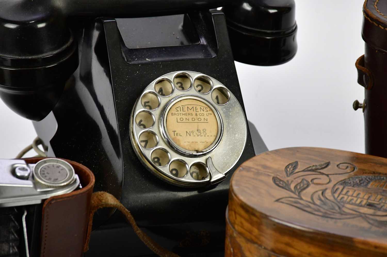 An assortment of collectors' items including a vintage bakelite telephone, a carved olive wood tea - Image 3 of 6