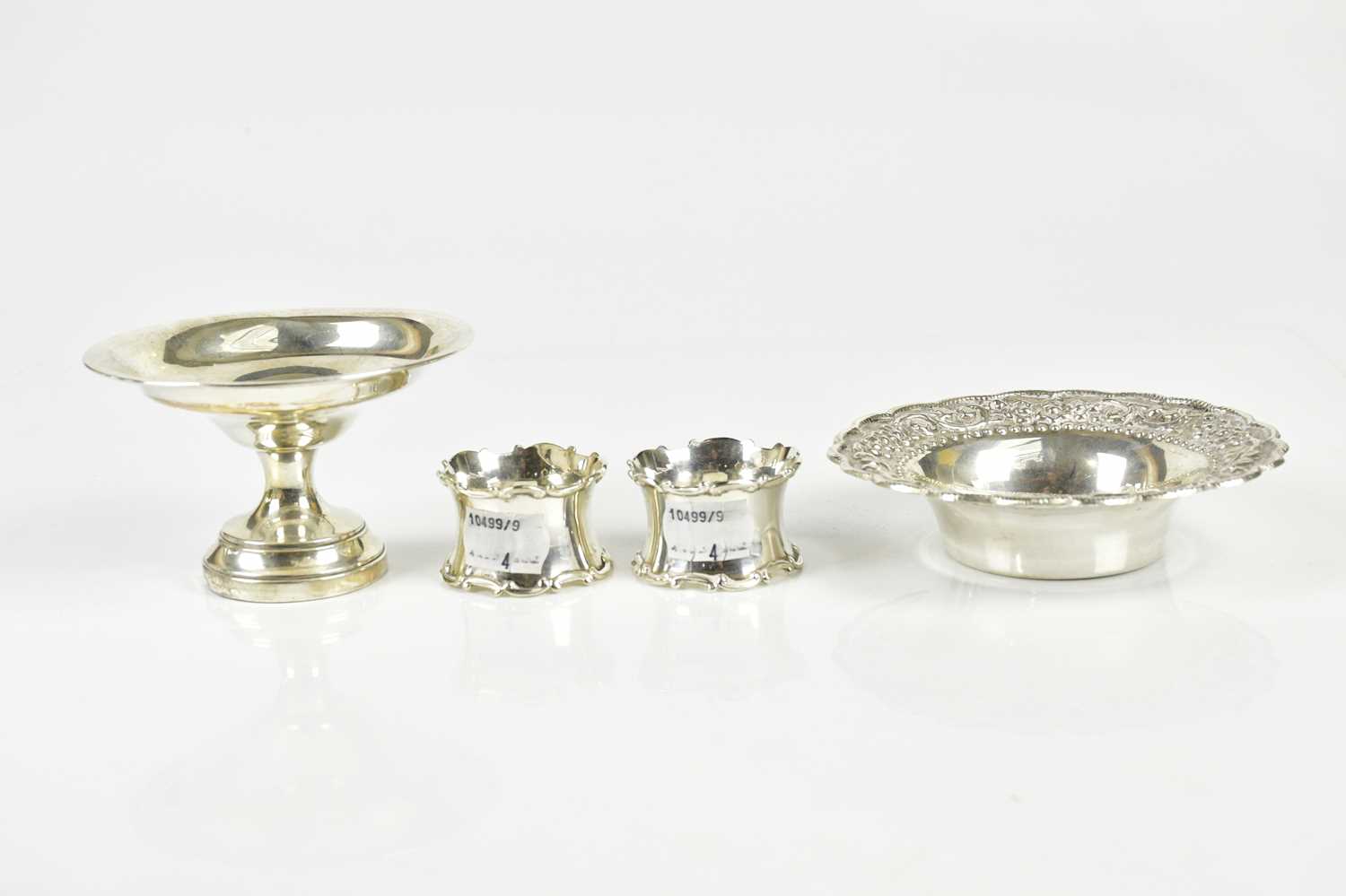 HORACE WOODWARD & CO; a pair of George V hallmarked silver napkin rings, Birmingham 1922, together