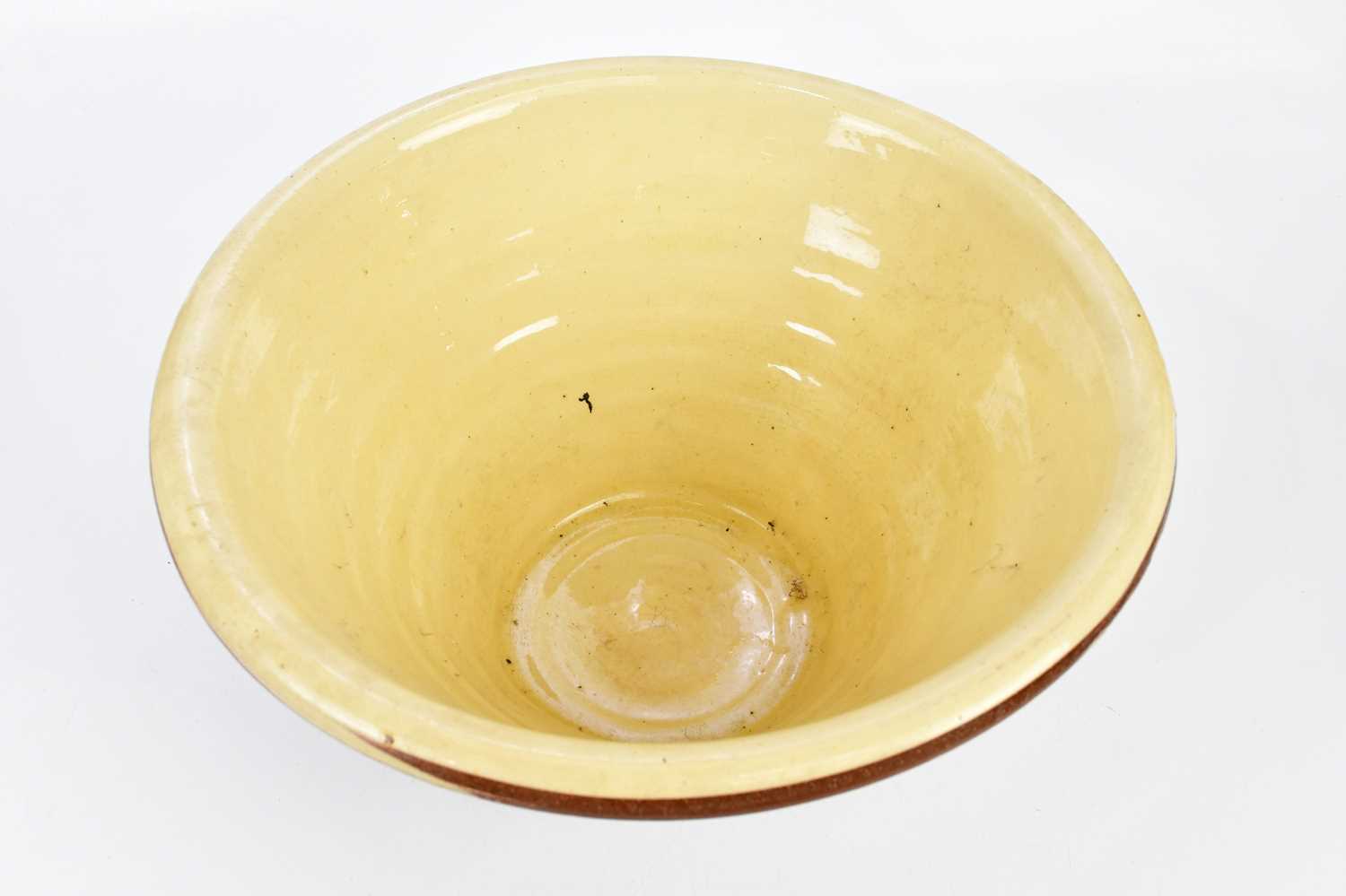 A large slipware terracotta dairy bowl, height 22cm. - Image 2 of 6