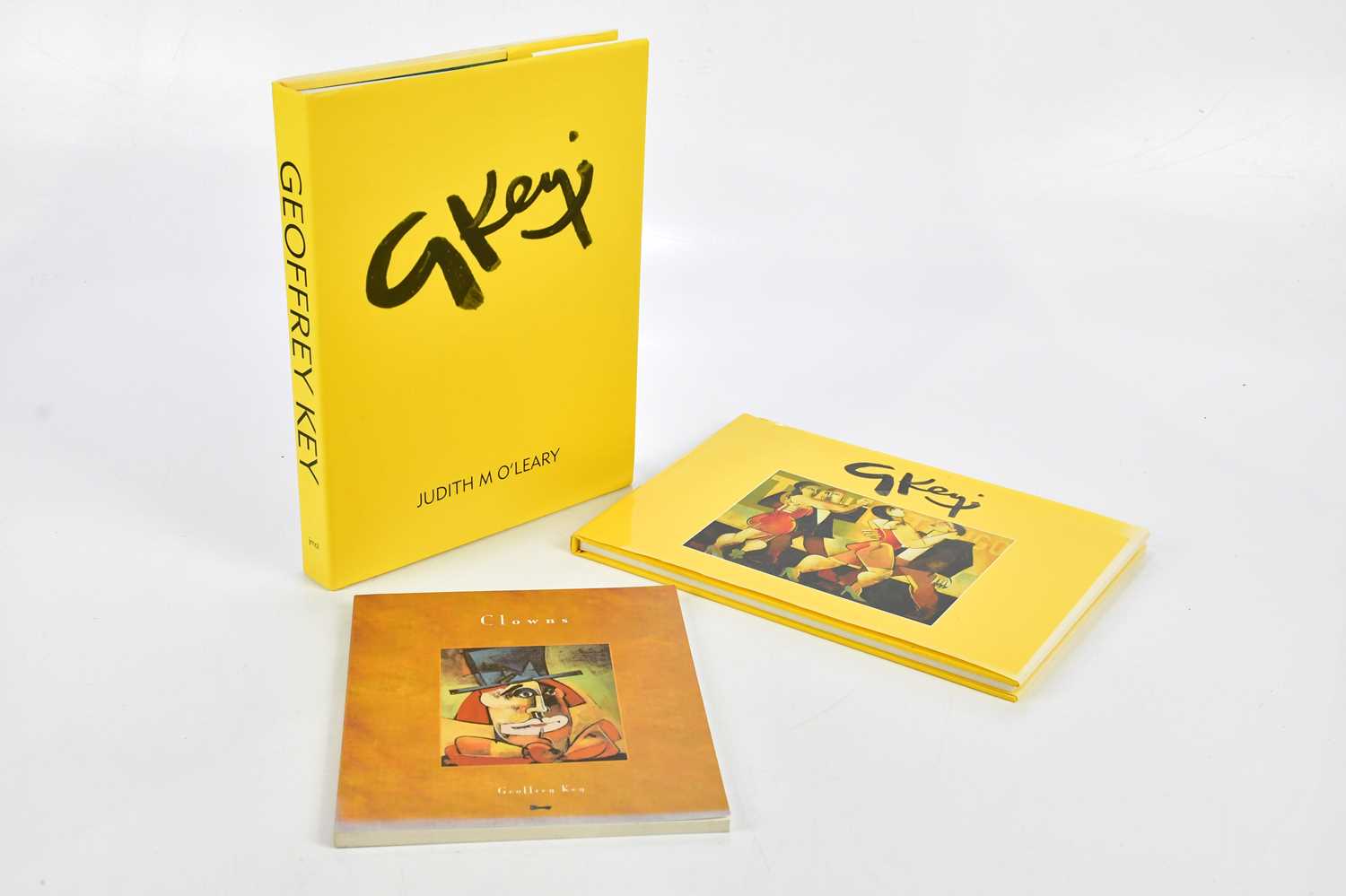 GEOFFREY KEY; a group of three books comprising Geoffrey Key paintings 'Clowns' and a signed copy of