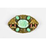 A Chinese jade and coral set base metal brooch, width 60mm (af). Condition Report: The clasp is