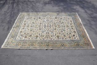 A beige ground wool carpet with floral pattern, 396 x 290cm.