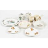 A collection of nursery ceramics, to include a Sooty mug, a Tom & Jerry mug, a trio decorated with