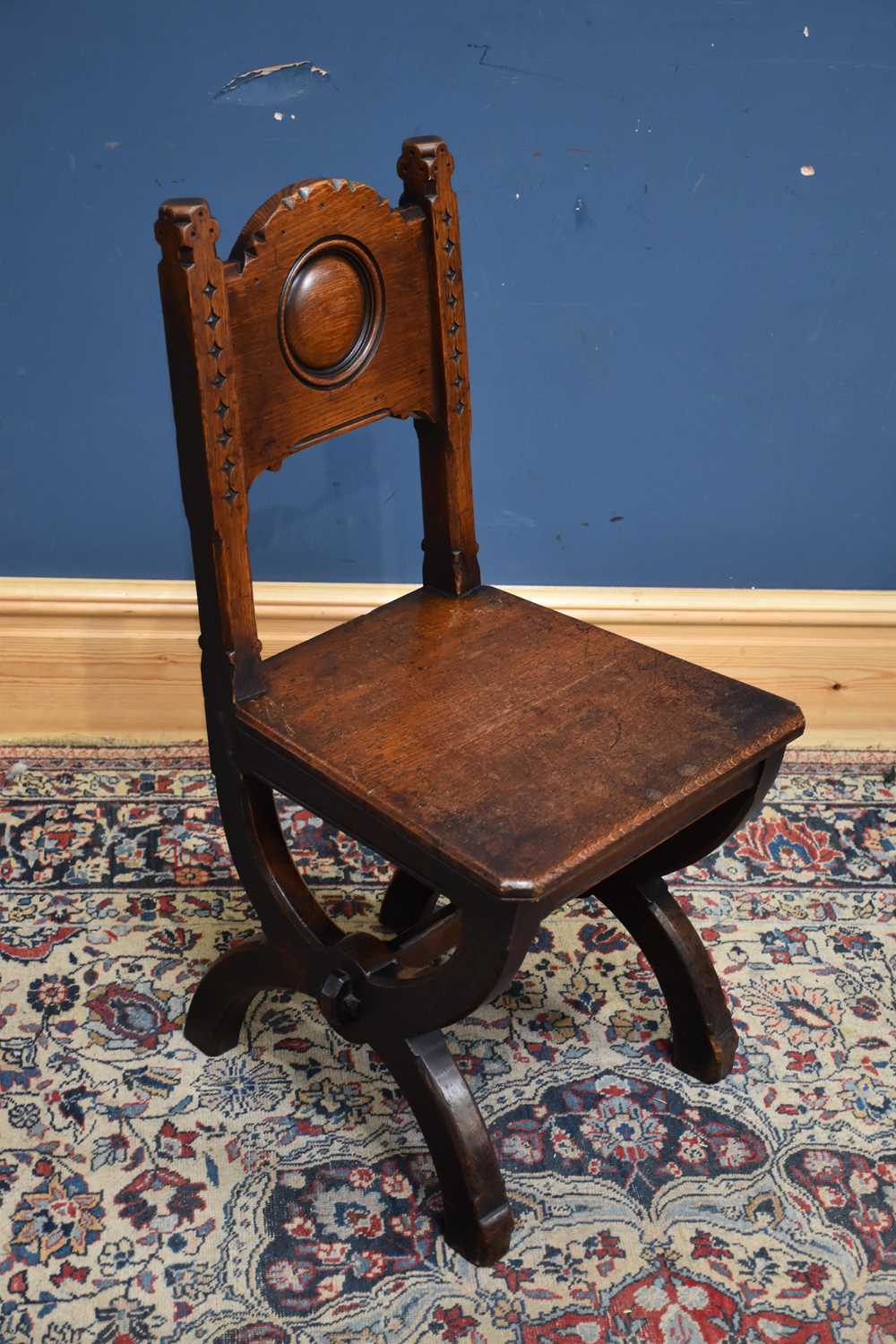 JOHN TAYLOR OF EDINBURGH; a late 19th century oak Arts and Crafts hall chair.