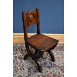 JOHN TAYLOR OF EDINBURGH; a late 19th century oak Arts and Crafts hall chair.
