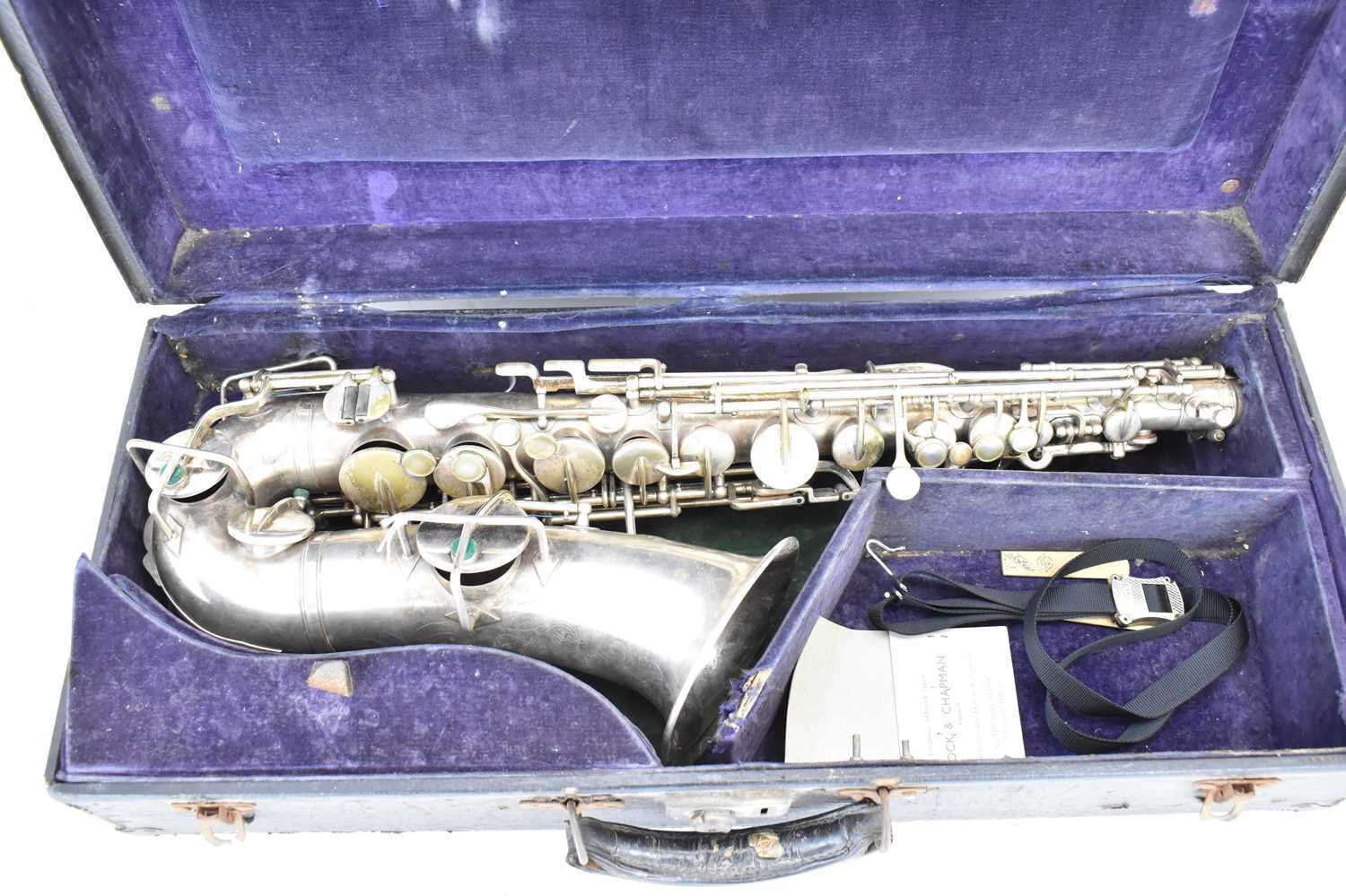 THE BUESCHER; a silver plated alto saxophone, marked 'True-Tone, Low Pitch', serial no. 245116, with