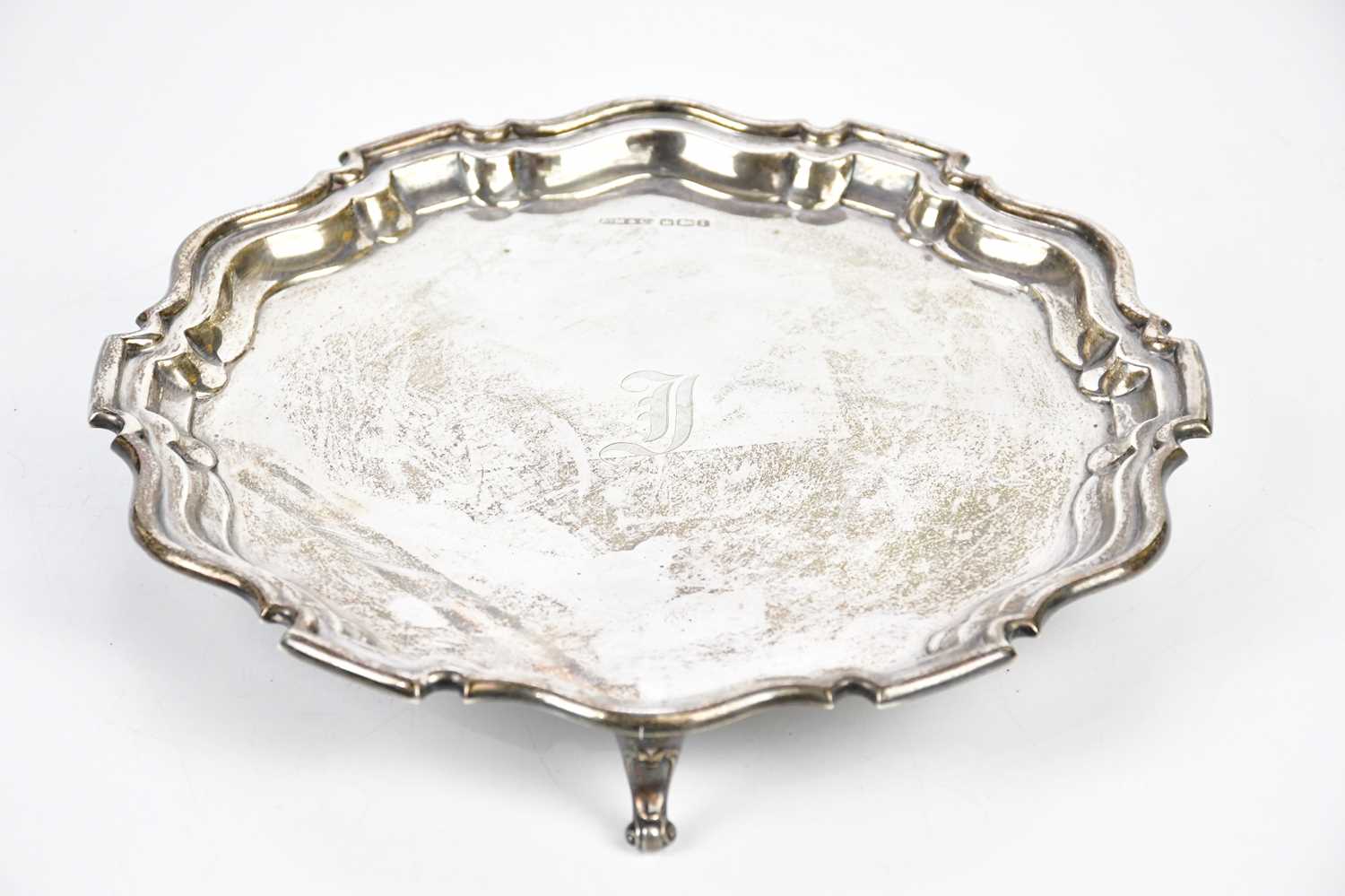 MARKS & CO; a George V hallmarked silver salver, with engraved initial ‘J’ to the centre, on