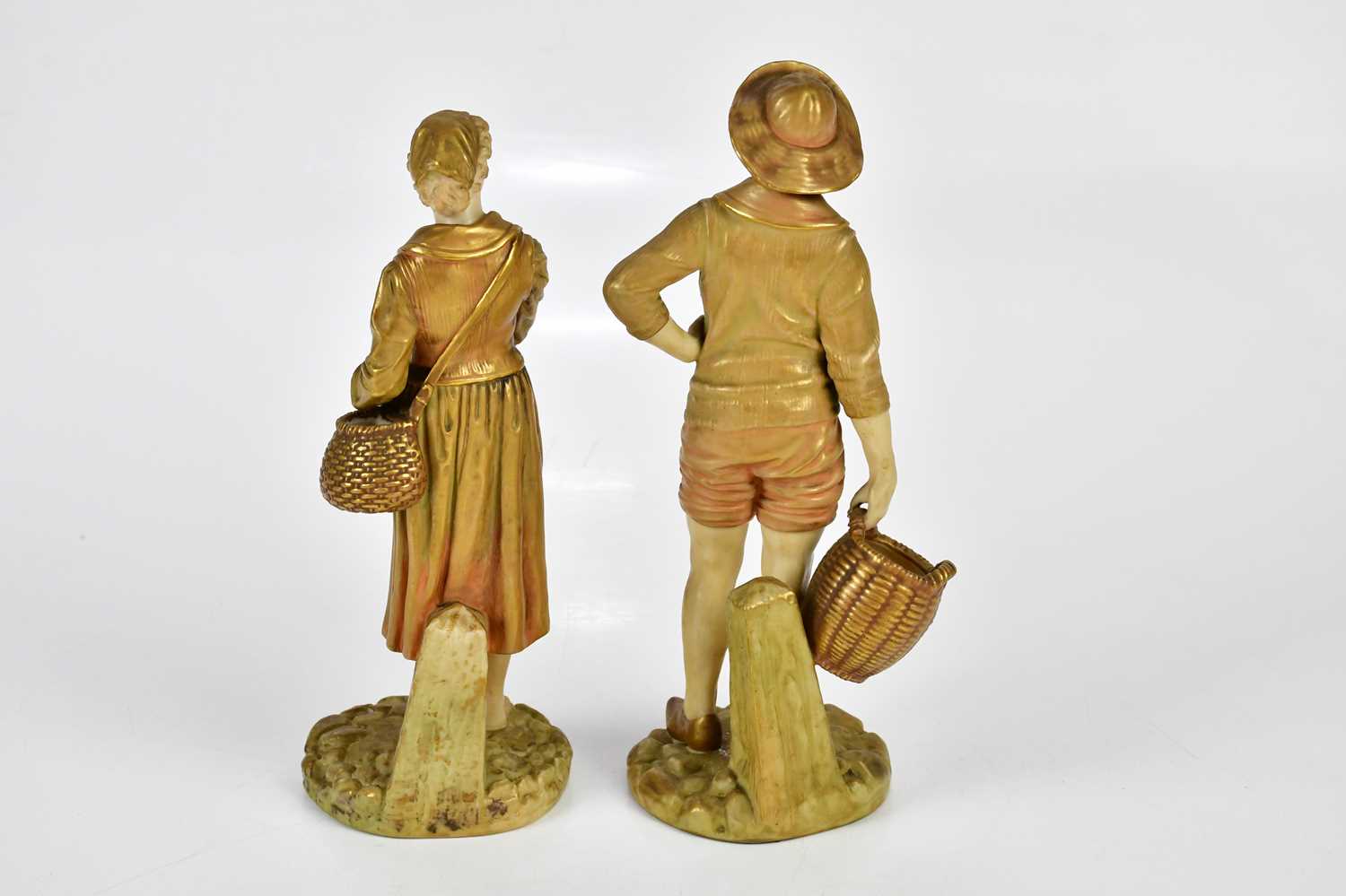 ROYAL WORCESTER; a pair of gilded blush ivory figures, a Dutch boy and girl holding baskets, factory - Image 4 of 5