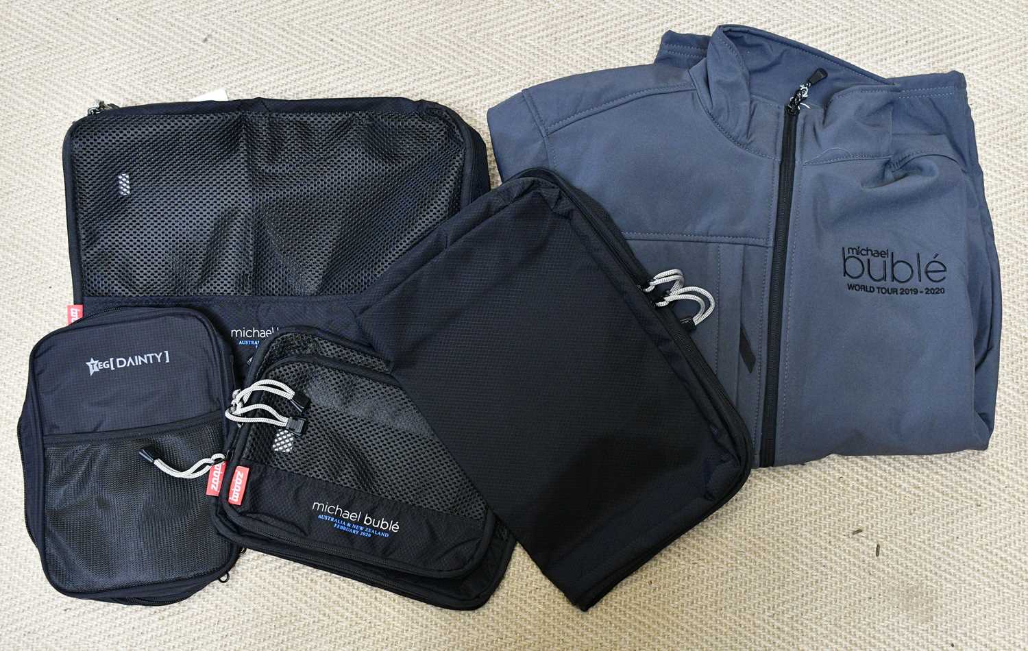 MICHAEL BUBLÉ; a stage crew World Tour 2009-2020 jacket and a laptop bag.