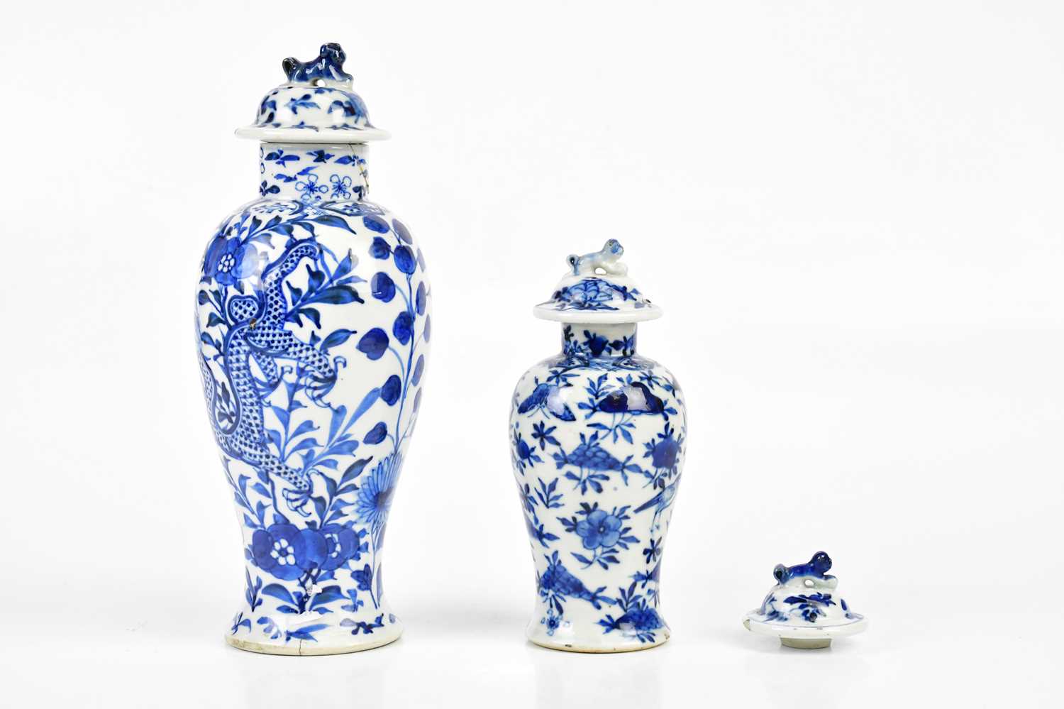 Two 19th century blue and white Chinese lidded vases and covers both with character marks to the