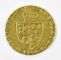 A George III gold spade guinea, 1794 (drilled and filled) Condition Report: The coin has been