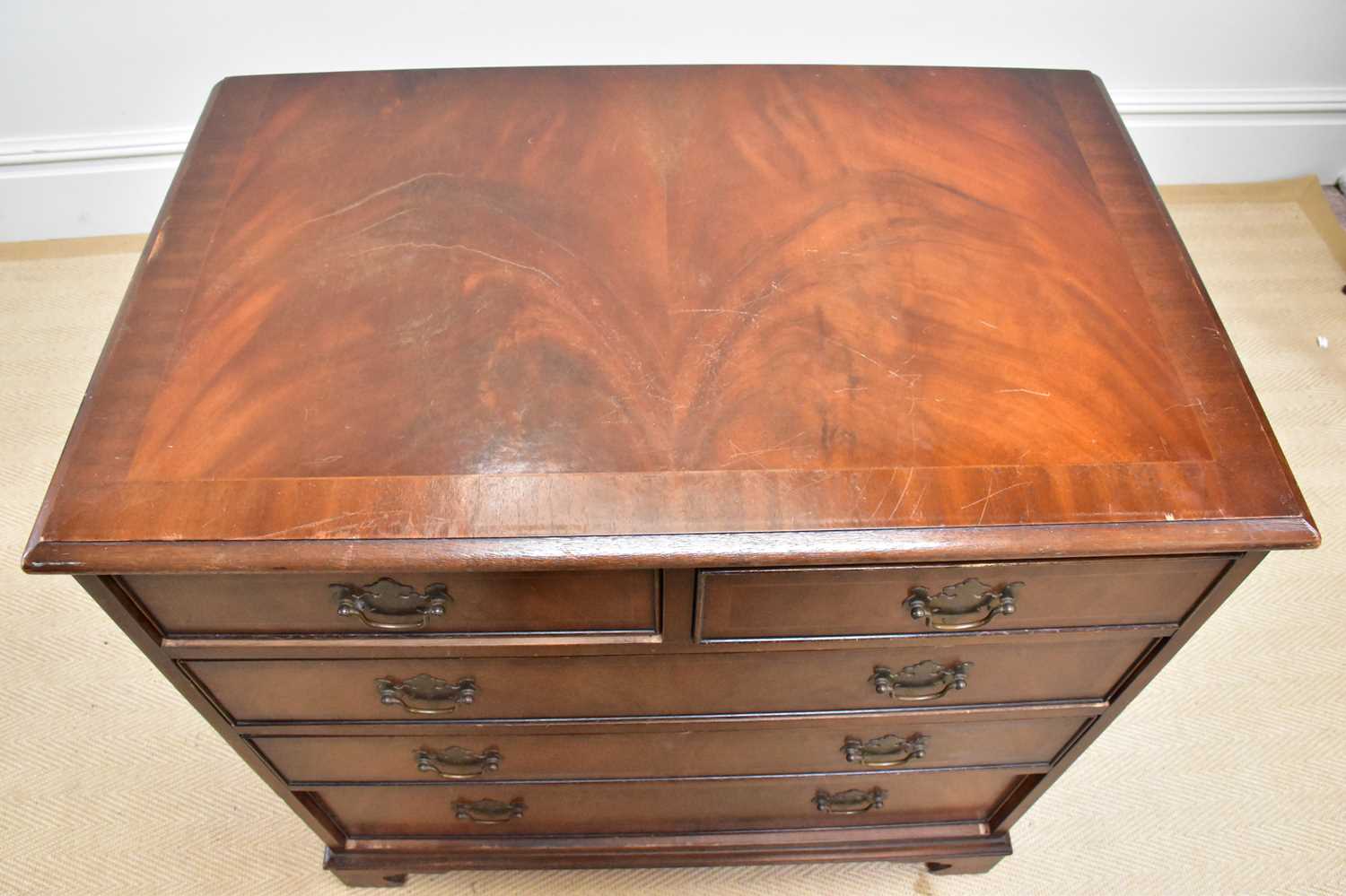 A reproduction mahogany chest of two short over three long drawers on bracket feet, width 79cm, - Image 2 of 2