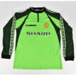 PETER SCHMEICHEL; a Manchester United Treble Winners retro style signed football shirt, signed to