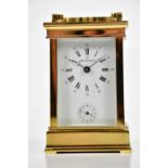 BOODLE & DUNTHORNE; a French brass cased carriage clock/timepiece, the enamel dial set with Arabic