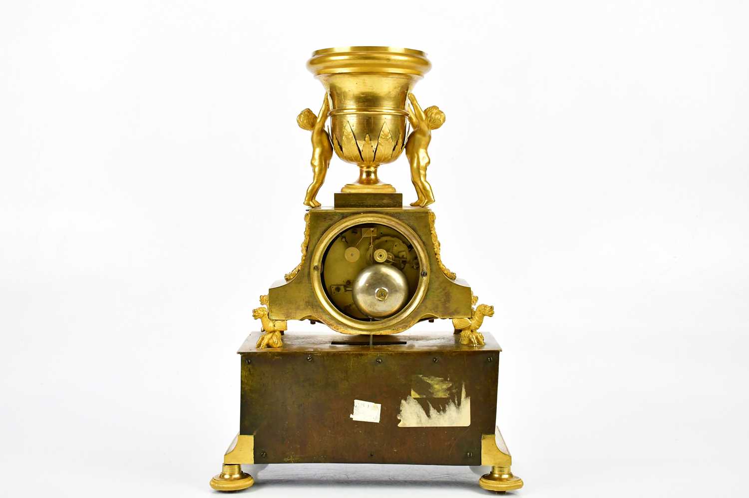 A late 19th century French ormolu mantel clock with cherubs supporting an urn finial above the - Image 6 of 7