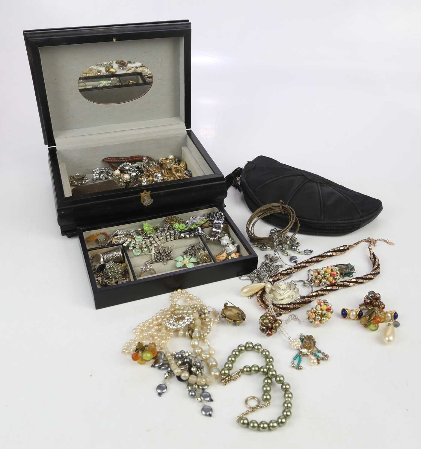 A collection of costume jewellery to include clip on earrings, brooches, rings, etc.