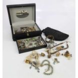 A collection of costume jewellery to include clip on earrings, brooches, rings, etc.