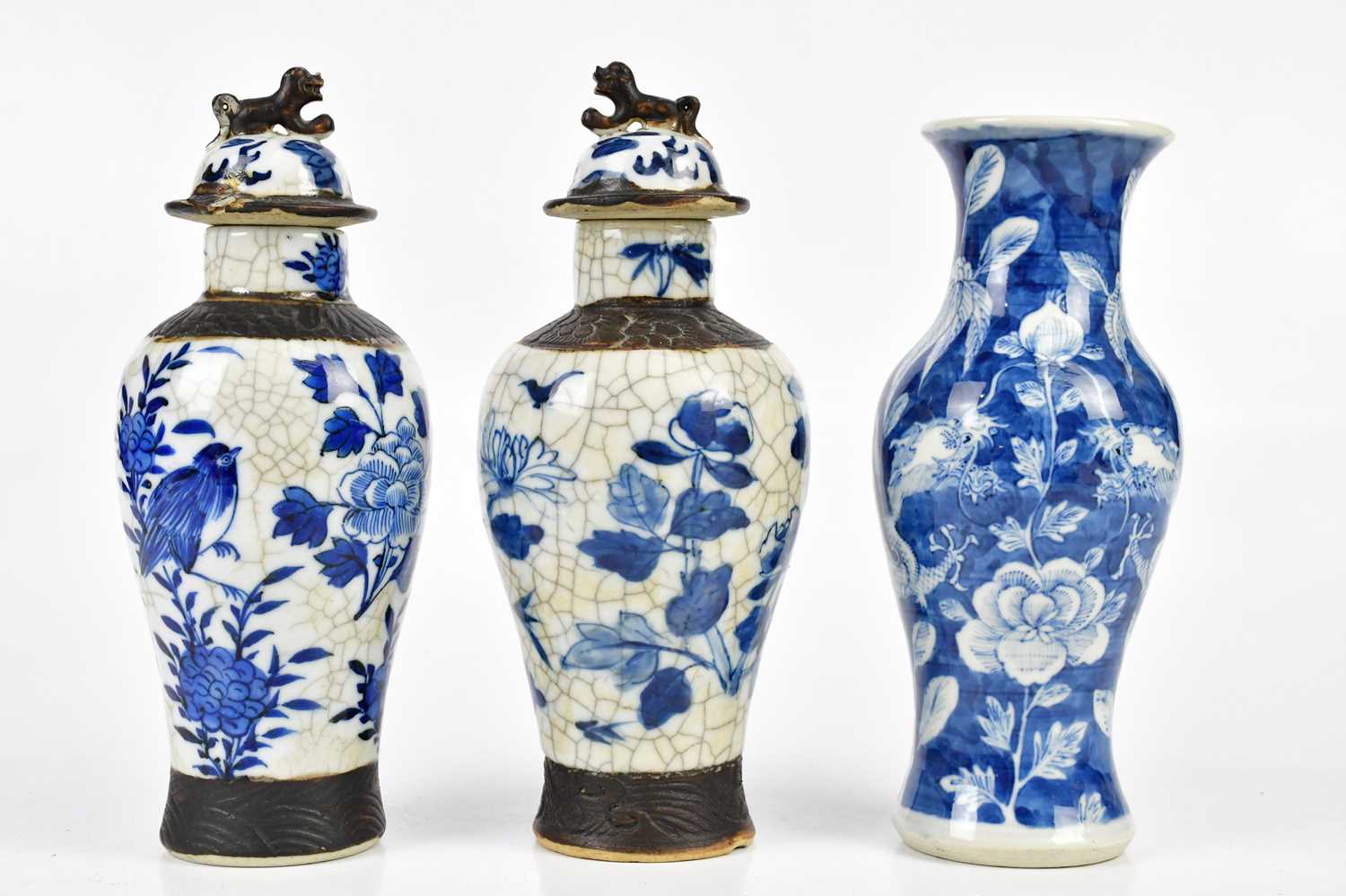 An early 20th century Chinese blue and white vase decorated with a four claw dragon, bears character