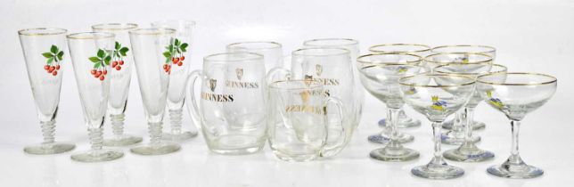 A collection of eight Babycham glasses, five Cherry B glasses and five Guinness glasses.