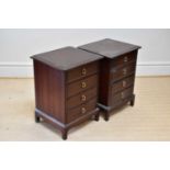 STAG MINSTREL; a pair of four drawer bedside chests on bracket feet, height 70cm, width 54cm,