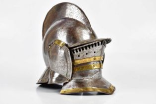 A reproduction Medieval style burgonet helmet, height 36cm.