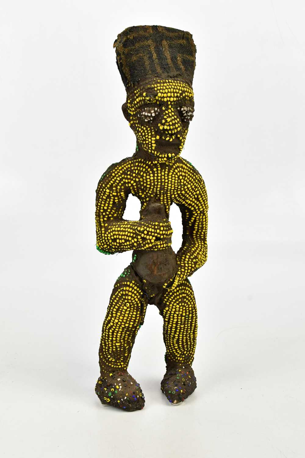 A Bamileke wood, clay and bead figure, height 46cm.