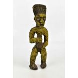 A Bamileke wood, clay and bead figure, height 46cm.