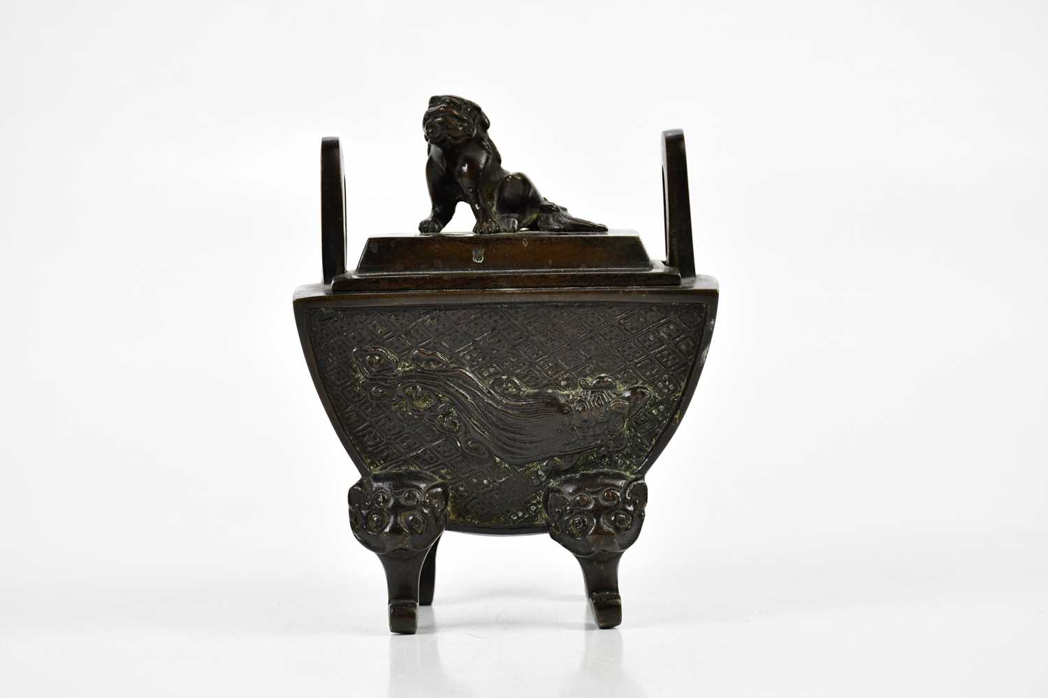 An early 20th century Japanese bronze Koro and cover with Shih Tzu dog mounted to the cover and