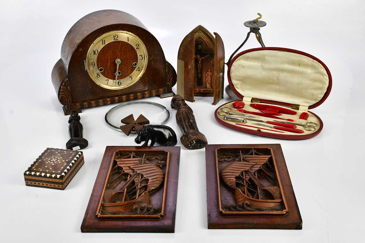 A mixed group of collectors' items to include an oak cased mantel clock, two African carved figures,