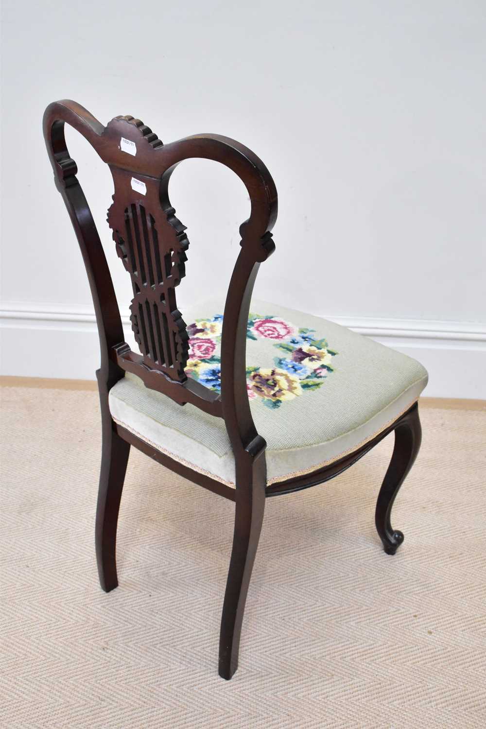 An Edwardian mahogany framed side chair, with carved open pierced back and floral woolwork seat. - Image 2 of 3