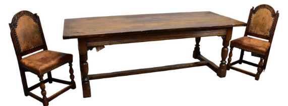 A reproduction oak refectory dining table on block legs, length 225cm, width 93cm, and six oak
