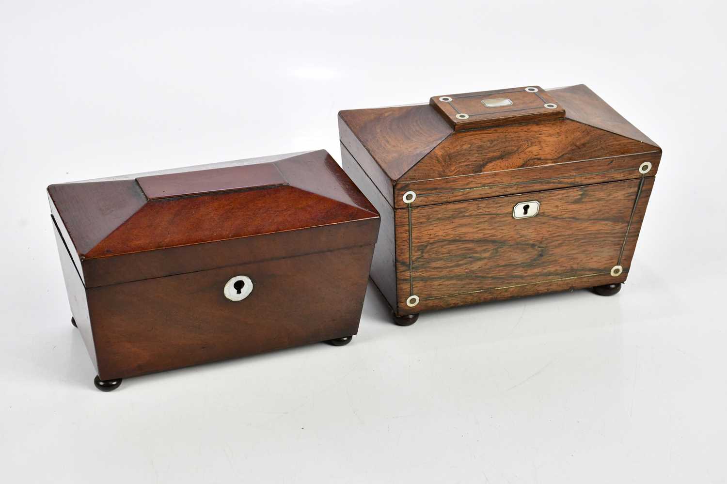 A 19th century rosewood sarcophagus shaped tea caddy with mother of pearl inlay, together with an
