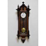 A late 19th/early 20th century rosewood cased Vienna style wall clock with ebonised relief decorated