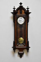 A late 19th/early 20th century rosewood cased Vienna style wall clock with ebonised relief decorated