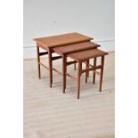 A mid 20th century teak nest of three tables, height 49cm, width 58cm, depth 36cm, together with a