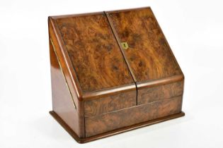 A Victorian walnut stationery cabinet, with two panelled doors enclosing divides, width 40cm, height