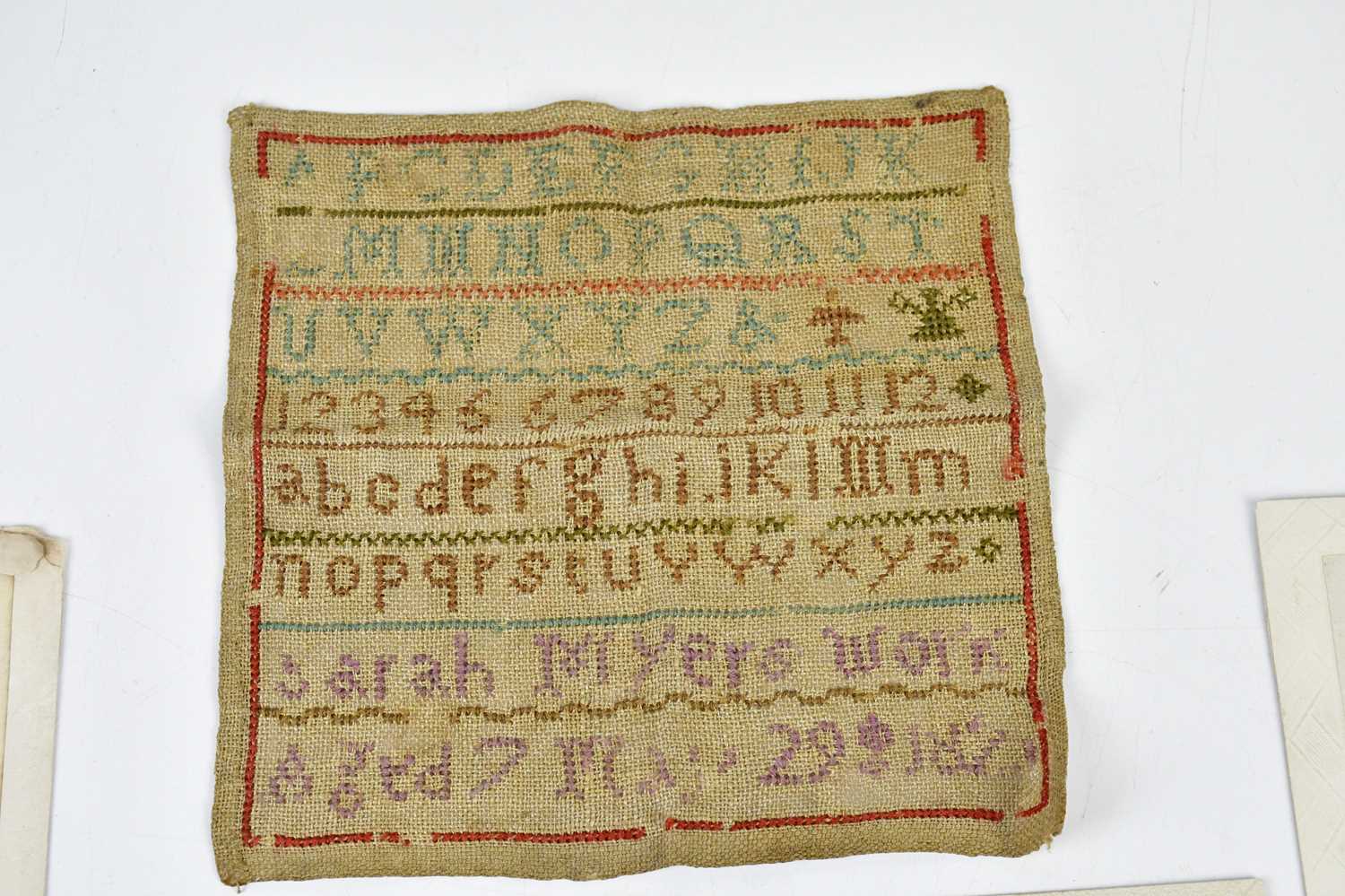 A 19th century alphabet sampler together with a mixed collection of WWI postcards. - Image 5 of 5