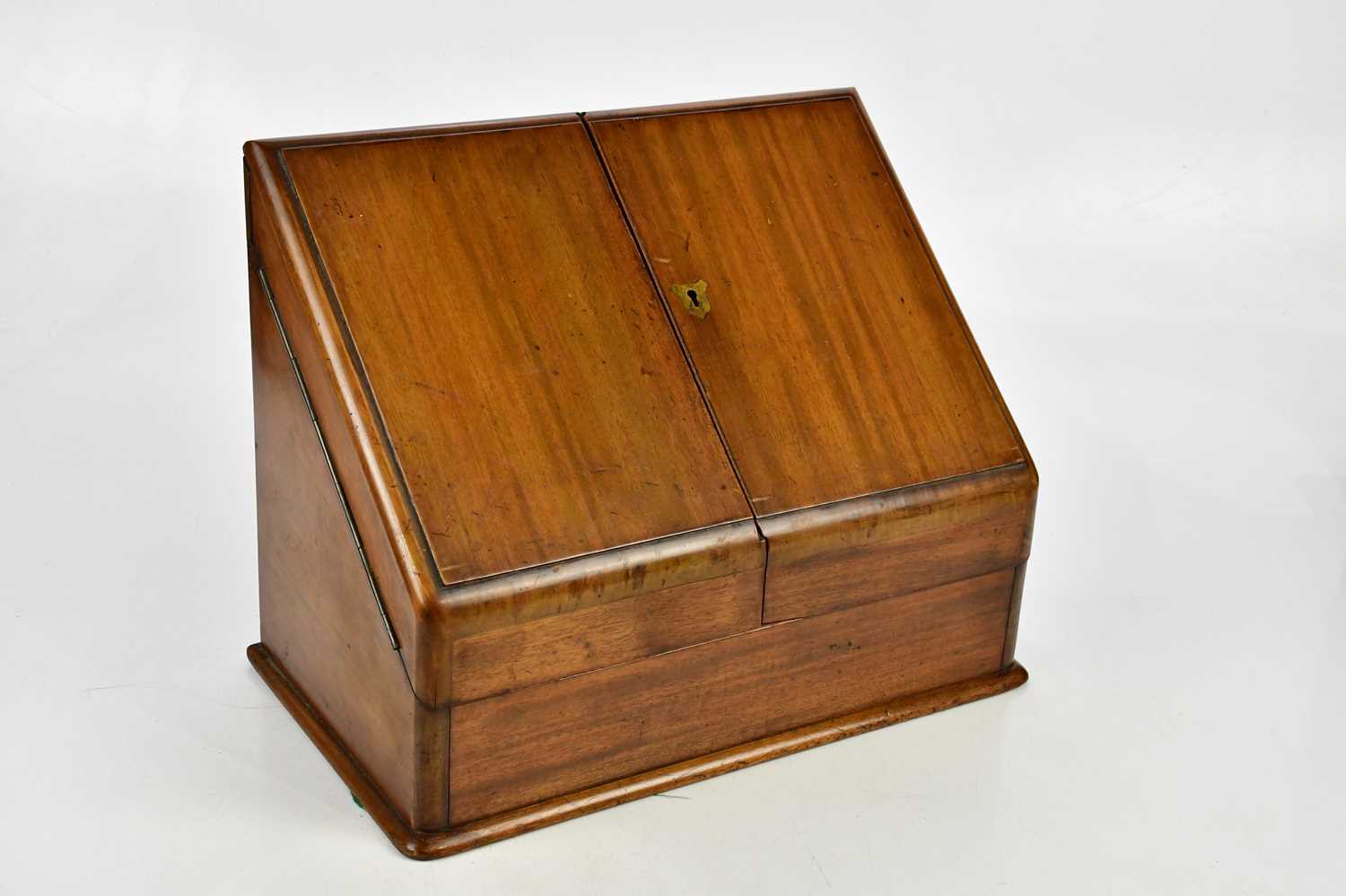 A Victorian mahogany stationery cabinet, the hinged covers enclosing pigeon holes and detachable