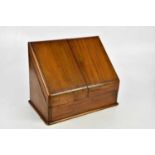 A Victorian mahogany stationery cabinet, the hinged covers enclosing pigeon holes and detachable