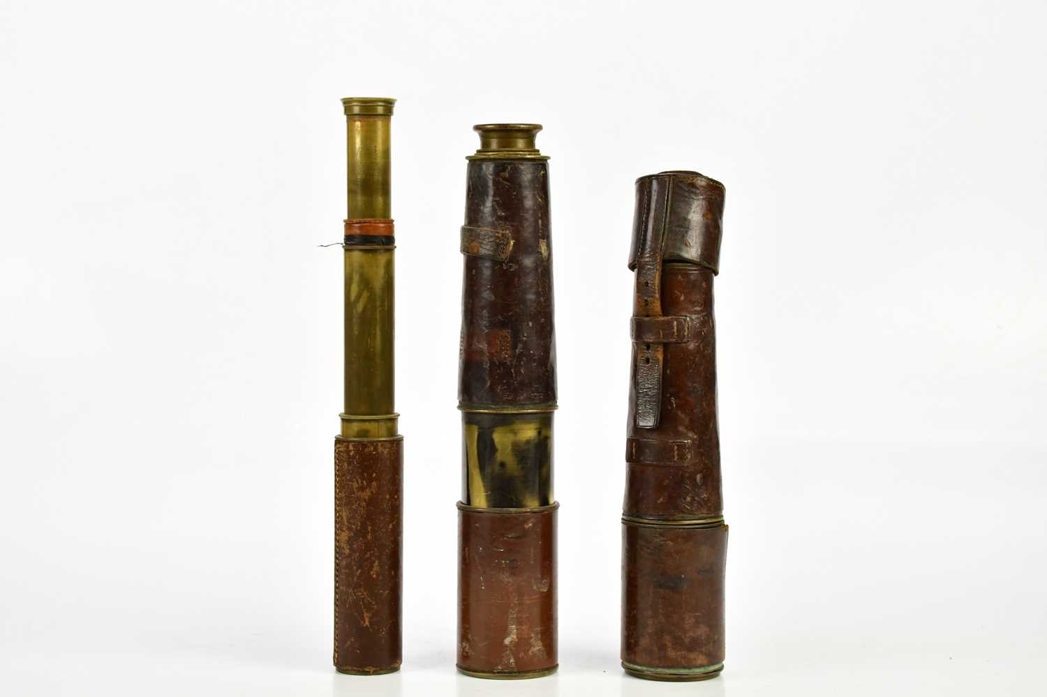 A military issue lacquered brass three draw telescope, numbered 20709, length extended 93cm, with