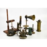 A collection of early 20th century scientific instruments to include a lacquered brass and cast iron