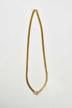 A yellow metal diamond set necklace stamped 750, set with a central brilliant cut diamond, approx