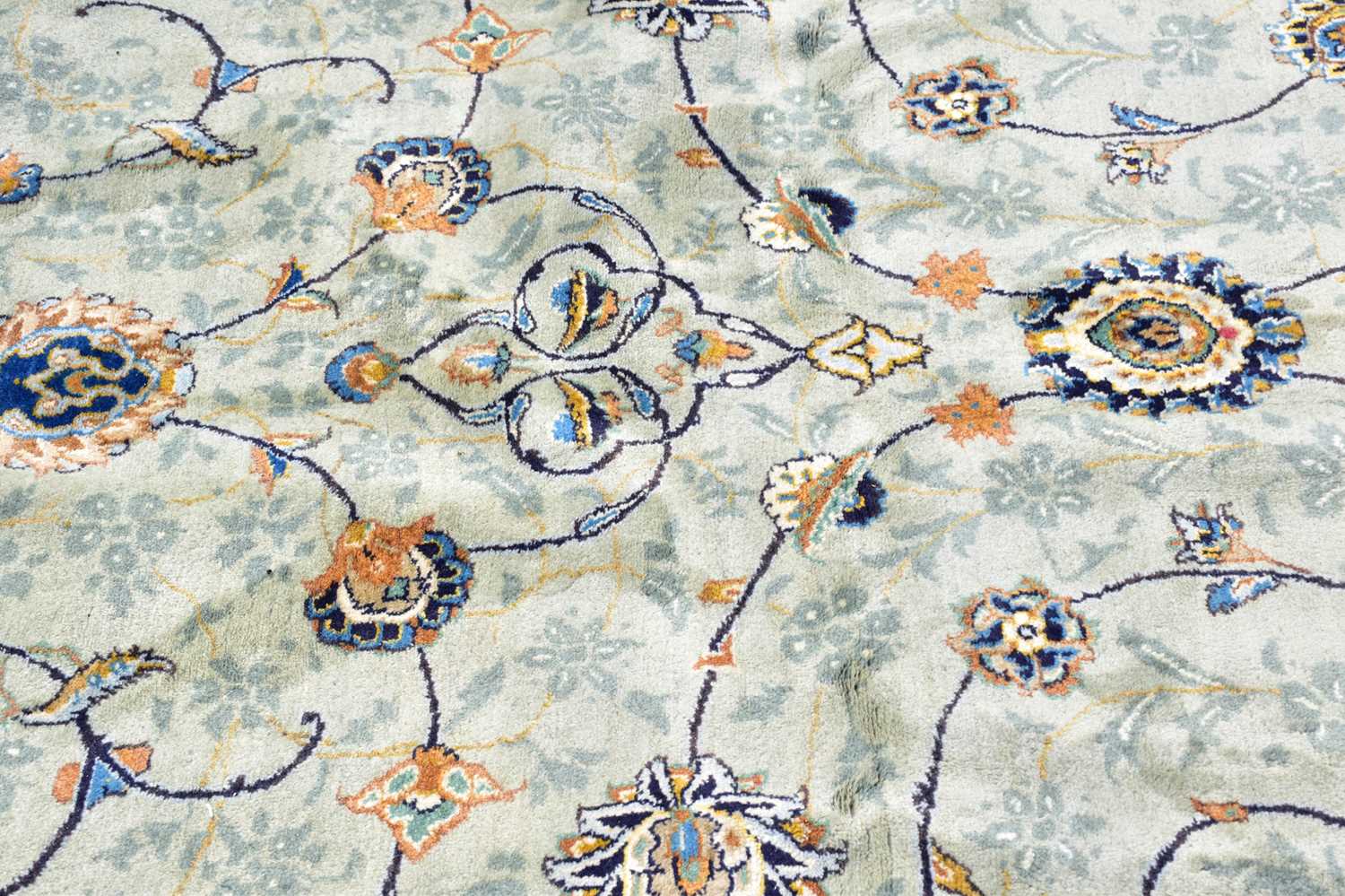 A pale blue wool carpet with floral pattern, 400 x 300cm. Condition Report: Worn corner and small - Image 2 of 8