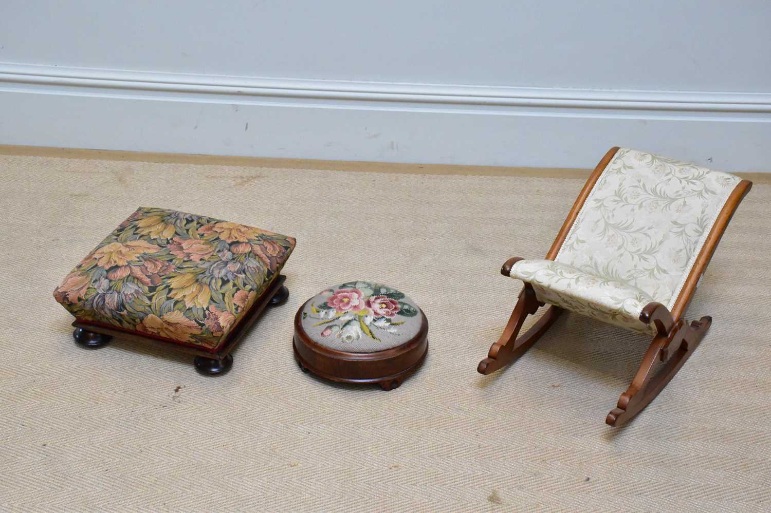 A late Victorian gout stool with floral tapestry panel, a Victorian tapestry topped stool and a